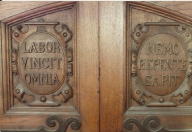 This image has an empty alt attribute; its file name is Mottoes-door.jpeg